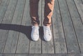 Fashion hipster cool man with white sneakers, soft vintage toned