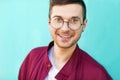 Fashion guy in glasses poses near the wall the color of the sour Royalty Free Stock Photo