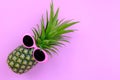 Fashion Hipster Pineapple on pink color background, Bright Summer Color, Tropical Fruit with Sunglasses, Creative Art concept. Mi Royalty Free Stock Photo