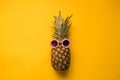 Fashion Hipster Pineapple in Sunglasses. Bright Summer Color. Tropical Fruit. Creative Art concept. Minimal style Hot Beach Party Royalty Free Stock Photo