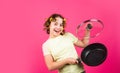 Fashion home shot. Pin-up style. Girl Holding Frying Pan. Little homemaker holding pan with ready meal. kid daily