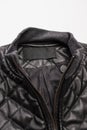 Fashion Ideas. Closeup View of Details of Open Collar of Mens Combined Textile and Leather Black Jacket Isolated on White