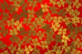 Background with golden leaves over bright red background