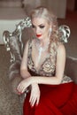 Fashion indoor portrait of beautiful sensual blond woman with ma Royalty Free Stock Photo