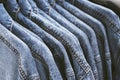 Fashion jeans jacket on hangers. Royalty Free Stock Photo