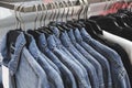 Fashion jeans jacket on hangers. Royalty Free Stock Photo