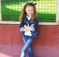 Fashion kid concept - stylish little girl child wearing a jeans Royalty Free Stock Photo