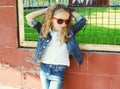Fashion kid concept - stylish little girl child wearing a jeans Royalty Free Stock Photo