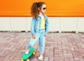 Fashion kid concept - stylish little girl child wearing a jeans Royalty Free Stock Photo