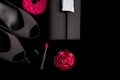 Fashion Lady Accessories Set. Black and pink. Minimal. Shoes, bracelet, perfume, lipstick and bag on black background. Flat lay. Royalty Free Stock Photo