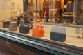 Fashion leather handbags in a boutique shop display window Royalty Free Stock Photo