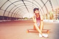 Fashion lifestyle, beautiful young woman with longboard Royalty Free Stock Photo