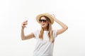 Fashion and Lifestyle Concept: pretty young woman wearing a hat, sunglasses takeing a photo of herself by mobile phone Royalty Free Stock Photo