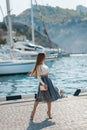 Fashion lifestyle portrait of young happy pretty woman laughing and having fun on the street at nice sunny summer day Royalty Free Stock Photo