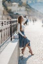 Fashion lifestyle portrait of young happy pretty woman laughing and having fun on the street at nice sunny summer day Royalty Free Stock Photo