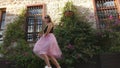 Fashion lifestyle portrait of young funny woman in tulle skirt