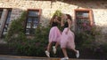 Fashion lifestyle two young women in tulle skirt funnily meet each other