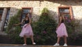 Fashion lifestyle two young women in tulle skirt funnily meet each other