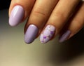 fashion lilac manicure with a shiny design