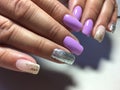 Fashion lilac manicure with silver design