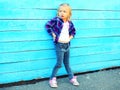 Fashion little girl child model posing on a blue background Royalty Free Stock Photo