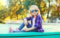 Fashion little girl child wearing a sunglasses and checkered shirt Royalty Free Stock Photo