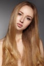 Fashion long hair. Beautiful blond girl. Healthy straight shiny hair style. Beauty woman model. Smooth hairstyle