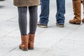 Fashion look of girl dressed in casual style in short skirt and broun boots