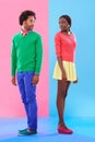 Fashion, love and young black couple in studio with colorful, trendy and stylish outfit for confidence. Bonding, full Royalty Free Stock Photo