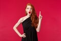 Fashion, luxury and beauty concept. Portrait of creative good-looking redhead woman in luxurious black dress have idea