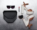 Fashion luxury female set, black handbag clutch, sunglasses, shoes heels, lipstick and little pocket mirror Royalty Free Stock Photo