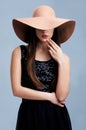 Fashion, luxury and woman in hat with vintage glamour, confidence and makeup in studio. Classic, chic and elegant style Royalty Free Stock Photo