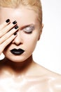 Fashion make-up. Shiny oil skin, black lips, nails