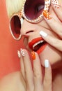 Fashion makeup and manicure orange color. Royalty Free Stock Photo