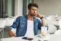 Fashion man in blue jeans shirt posing outdoor Royalty Free Stock Photo