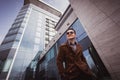 Fashion man in front of a glass building Royalty Free Stock Photo