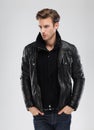 Fashion man, model leather jacket, gray background Royalty Free Stock Photo