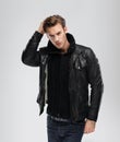 Fashion man, model leather jacket, gray background Royalty Free Stock Photo