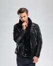 Fashion man, model leather jacket, gray background Royalty Free Stock Photo