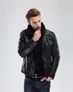 Fashion man, model leather jacket, gray background Royalty Free Stock Photo