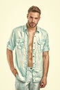 Fashion man in unbuttoned shirt isolated on white background. Too for shirt. Handsome and sensual. Casual in style