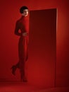 Fashion, mockup and a model woman in a red background in studio for marketing, advertising or branding. Luxury