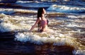 Fashion model in American flag bikini, swimwear relax on the beach. Luxury Royalty Free Stock Photo