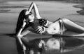Fashion model in American flag bikini, swimwear relax on the beach, wallpaper Royalty Free Stock Photo