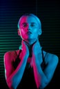 Fashion model blonde woman in colorful bright neon lights Royalty Free Stock Photo