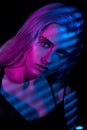 Fashion model blonde woman in colorful bright neon lights Royalty Free Stock Photo