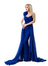 Fashion Model in Blue Dress. Elegant Blond Woman in Long Evening Gown over  White Studio Background Royalty Free Stock Photo