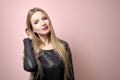 Fashion model with bright makeup. Portrait of young fashion woman with long blond hair Royalty Free Stock Photo