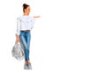 Fashion model brunette girl full length portrait in blue jeans and white shirt , backpack, in sneakers modern shoes Royalty Free Stock Photo