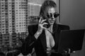 Fashion model business woman in sunglasses using laptop. Businesswoman wear look style. Beauty sexy model girl in trendy